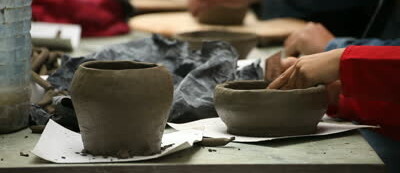 stock_footage_pottery_class_workshop_clay_shaping_on_potter_s_wheel