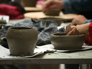stock_footage_pottery_class_workshop_clay_shaping_on_potter_s_wheel